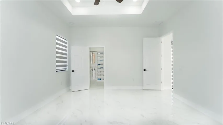 Spare room with ceiling fan