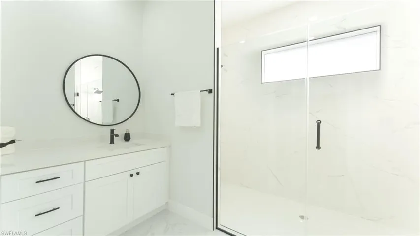Bathroom featuring vanity and walk in shower