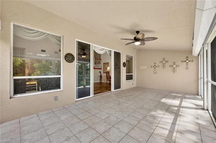 Unfurnished sunroom with a ceiling fan