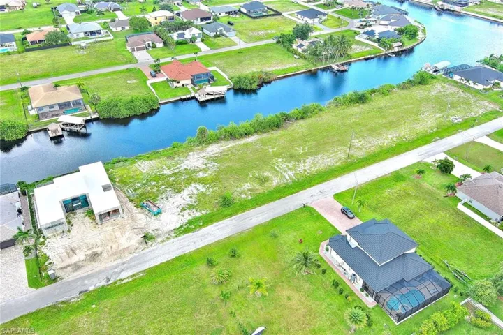 Aerial perspective of suburban area with a large body of water