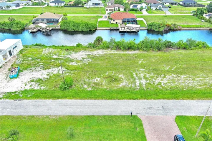 Aerial perspective of suburban area with a large body of water