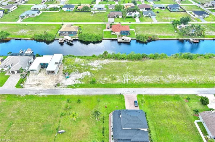 Aerial view of residential area with a nearby body of water