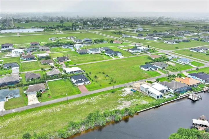 Aerial view of residential area with a nearby body of water