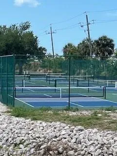 View of Pickle Ball court featuring fence