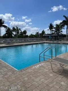Community pool featuring a patio