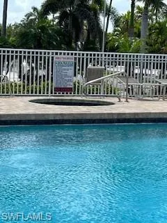View of community pooland spa