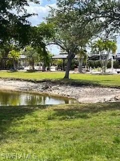 View of property's community with a lawn