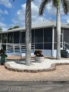 View of front of property featuring a sunroom