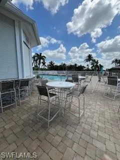 View of patio / terrace featuring a swimming pool
