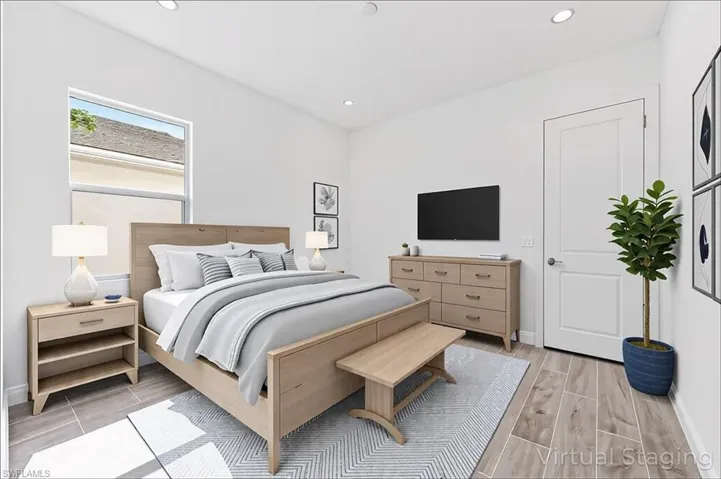 Bedroom with baseboards, wood finish floors, and recessed lighting
