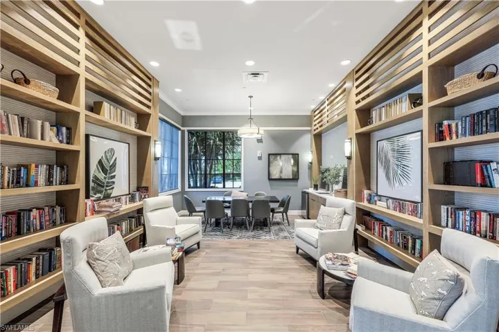 Sitting room featuring light wood-type flooring, crown molding, visible vents, and recessed lighting