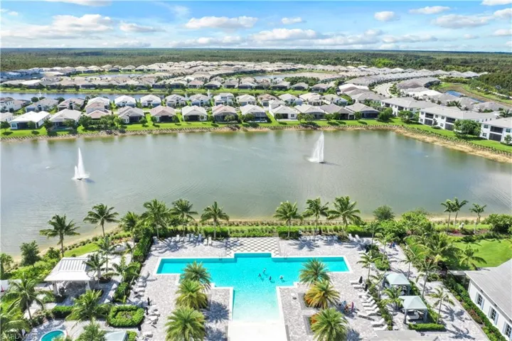 Aerial view featuring a water view and a residential view