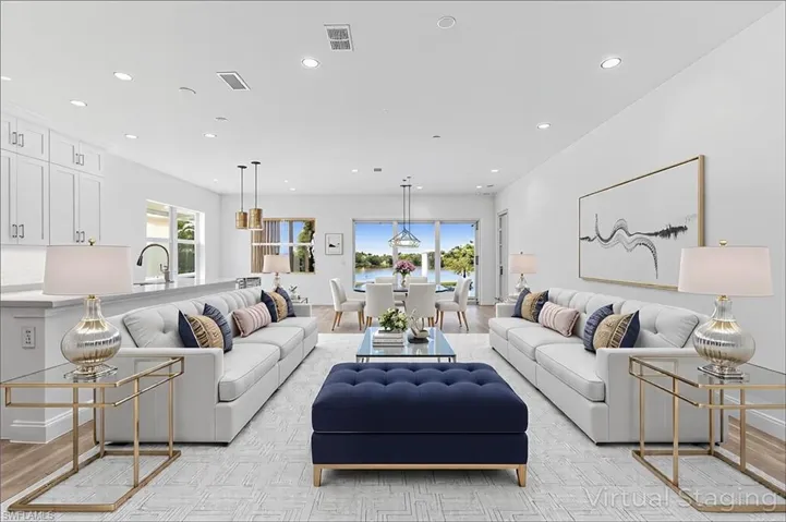 Living area with visible vents and recessed lighting