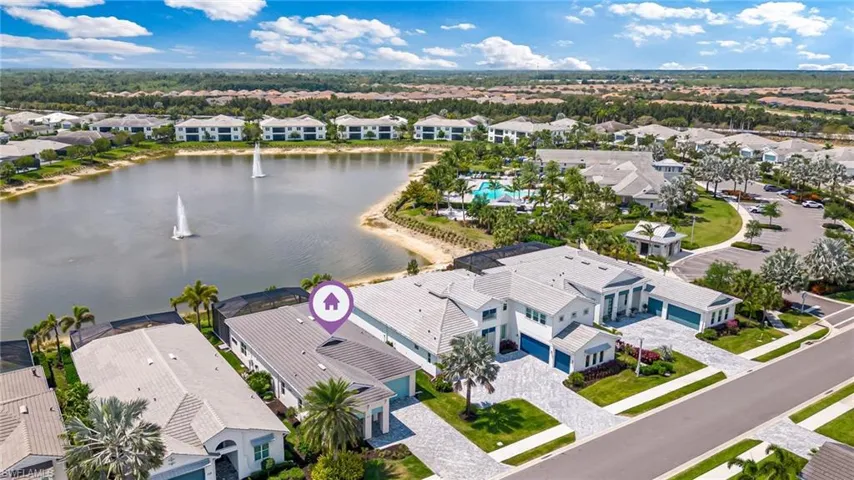 Birds eye view of property with a residential view and a water view