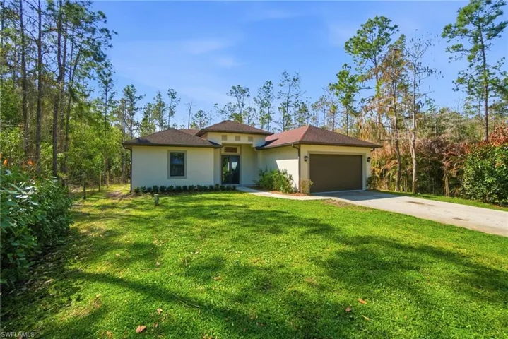 2018 CUSTOM-BUILT HOME ON A GORGEOUS, GATED & FENCED, 1.14 ACRE LOT IN GOLDEN GATE ESTATES WITH NO HOA RESTRICTIONS!