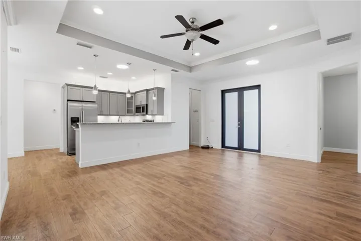 3 bed + den, 2 bath, 2-car garage home offers an open & split bedroom floor plan with wood & tile floors throughout (no carpet anywhere!). Hurricane-Impact Windows & Doors.
