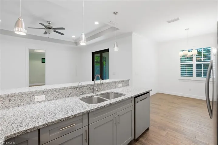 High ceilings with tray ceiling accents, beautifully appointed kitchen & baths