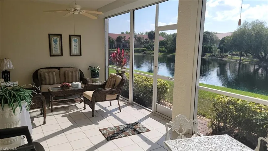 Sunroom / solarium with a water view, an outdoor hangout area, and ceiling fan