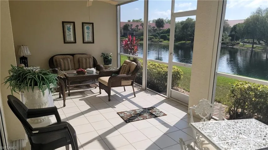 Sunroom with a water view