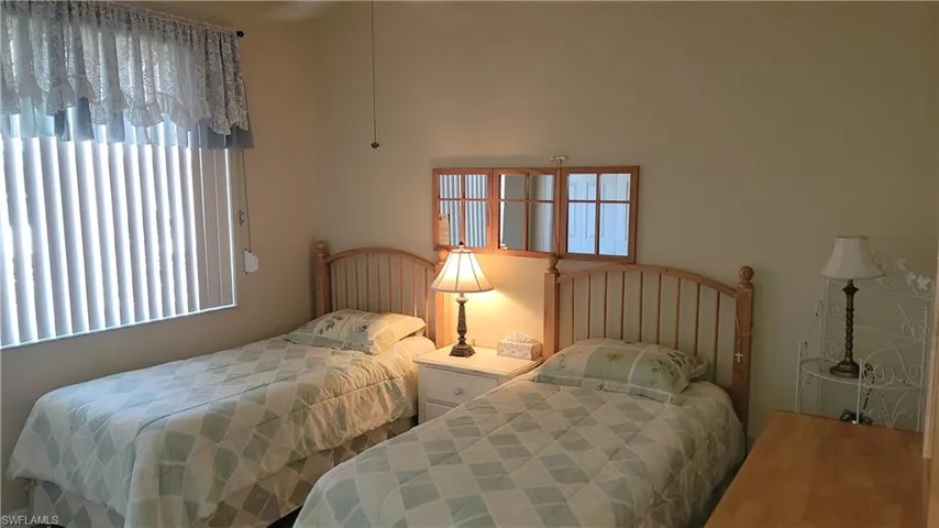 Bedroom featuring multiple windows