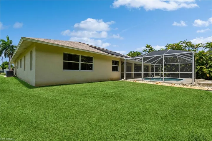 Back of house featuring a corner lot