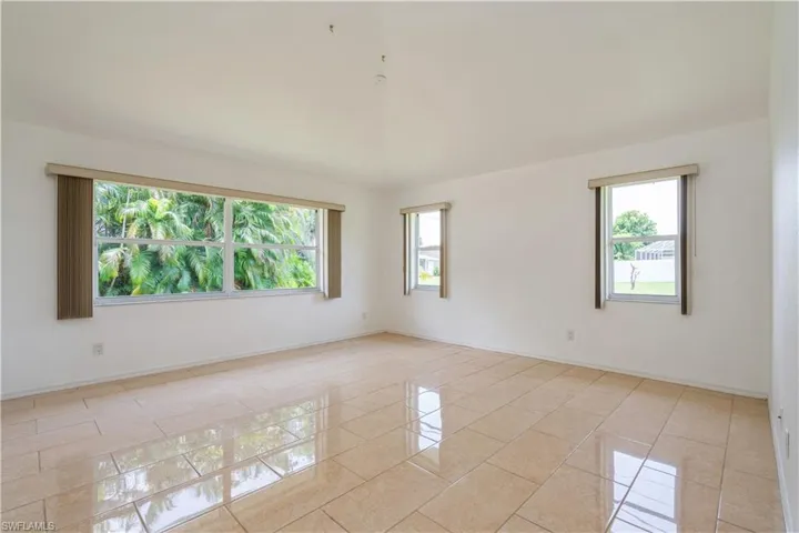Family room with high ceilings and lots of natural lighting