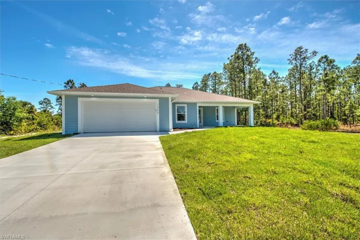 Long driveway with can lighting above the door entry