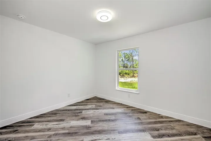 Guest bedroom 4 with a backyard view