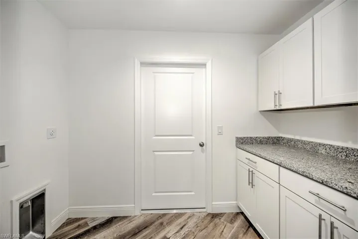 Laundry room with pantry storage is just off the kitchen leading to the garage.