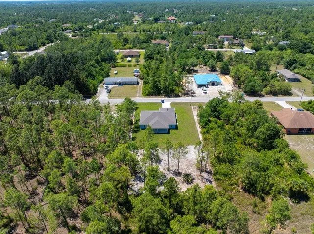 Aerial View from the back of the property via drone. You can see the cleared area where this property continues.