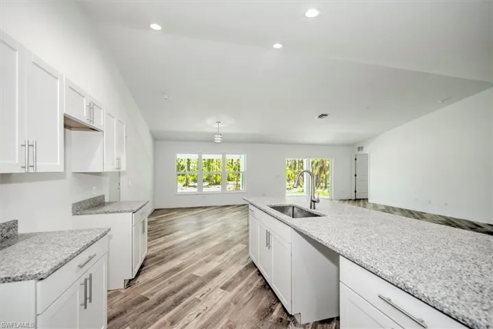 Kitchen view toward the 3 windows is the dining area. The open concept is excellent in this home. Perfect for entertaining.