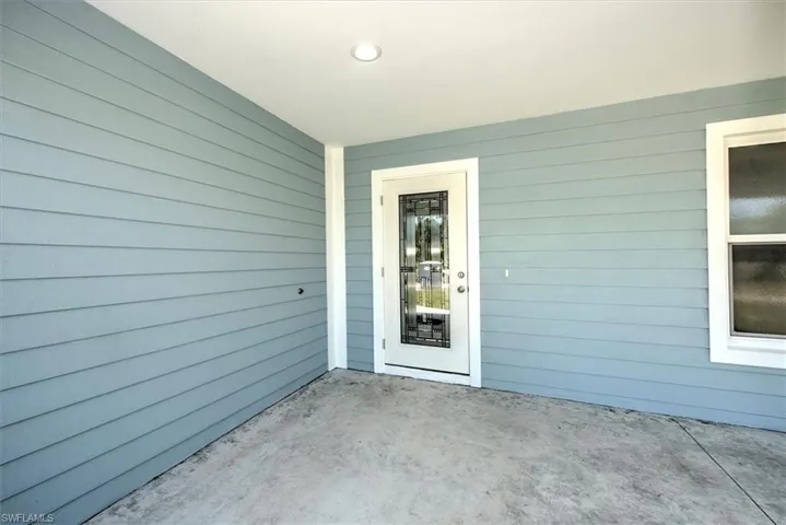 The entry door has decorative privacy glass that is also impact resistant.