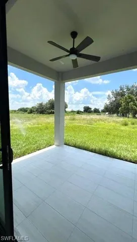 View of patio with a rural view and ceiling fan