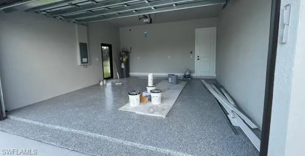 Garage featuring electric water heater