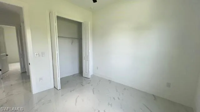 Unfurnished bedroom with a closet
