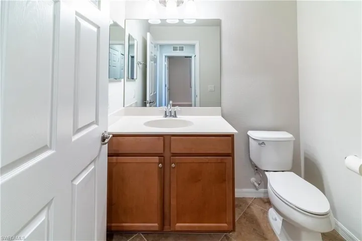 Bathroom featuring vanity and light tile patterned floors
