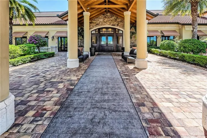 Doorway to property featuring french doors and stone siding