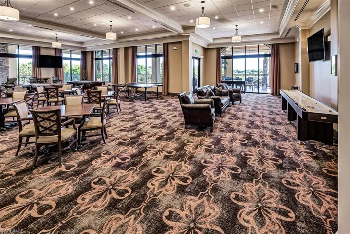 Community lobby with ornamental molding and recessed lighting