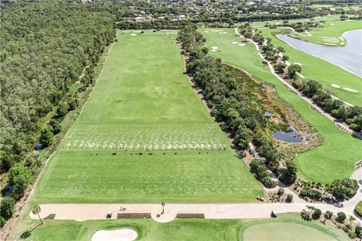 Bird's eye view of a nearby body of water and a golf course