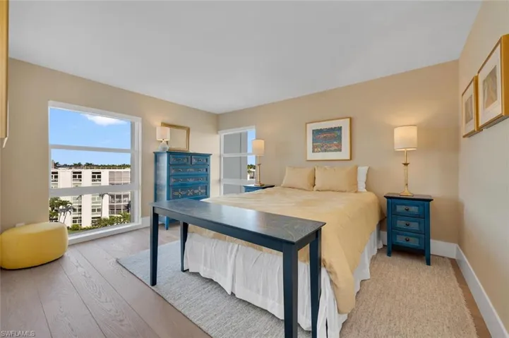 Bedroom featuring light wood finished floors and baseboards