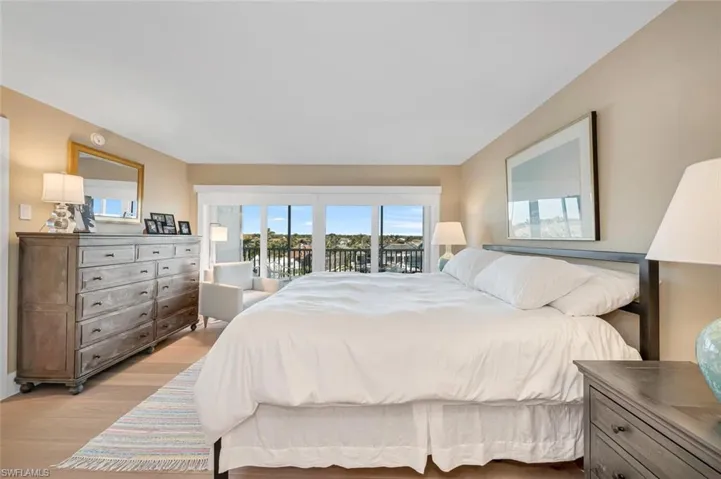 Bedroom featuring access to exterior and light wood finished floors