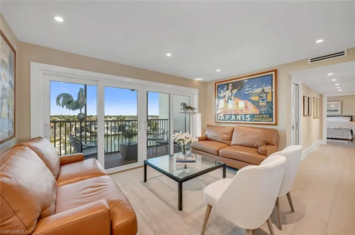 Living room with light wood-style flooring, recessed lighting, baseboards, and visible vents