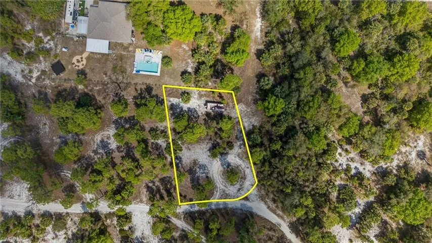 Aerial overview of property's location featuring property parcel outlined