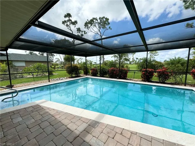 View of pool featuring a patio and a lanai