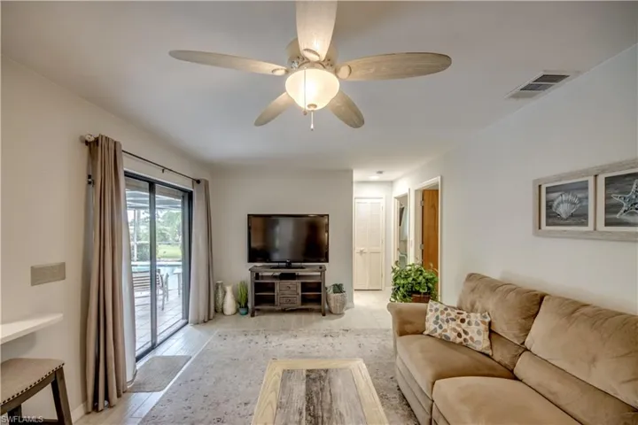 Unfurnished living room with light hardwood / wood-style floors and ceiling fan