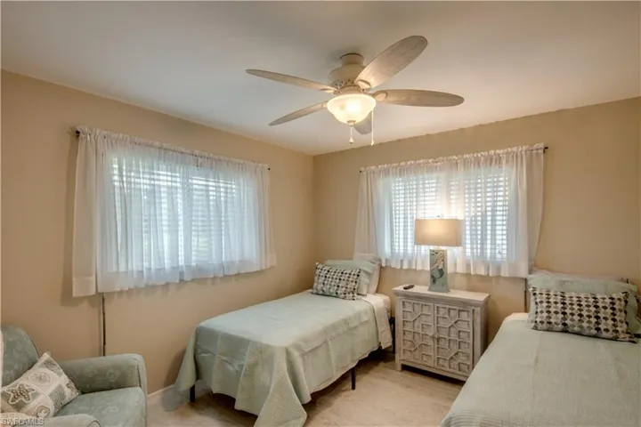 Bedroom with light wood-type flooring and ceiling fan
