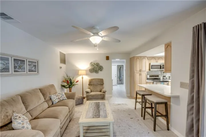 Tiled living room with ceiling fan