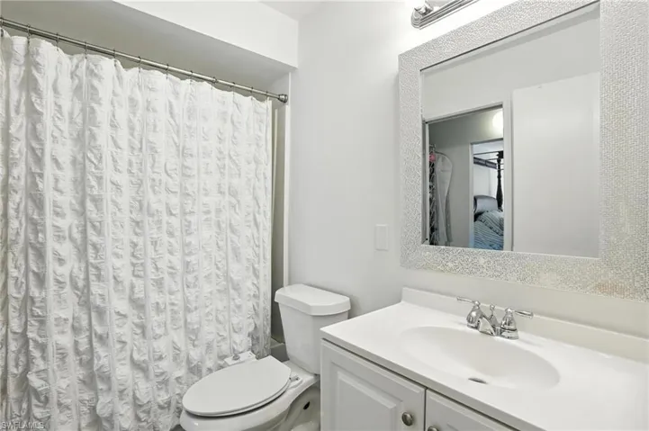 Bathroom with vanity and a shower with curtain