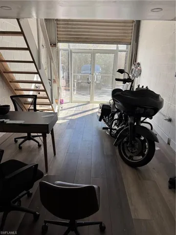 Storage with dark wood-style floors