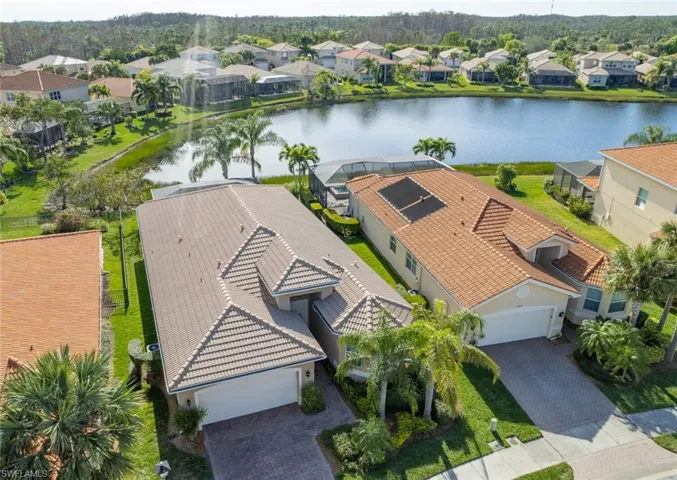 Aerial perspective of suburban area with a large body of water